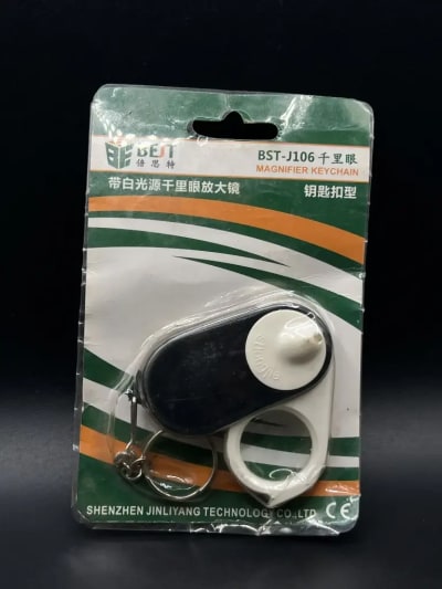 Small magnifying glass with light