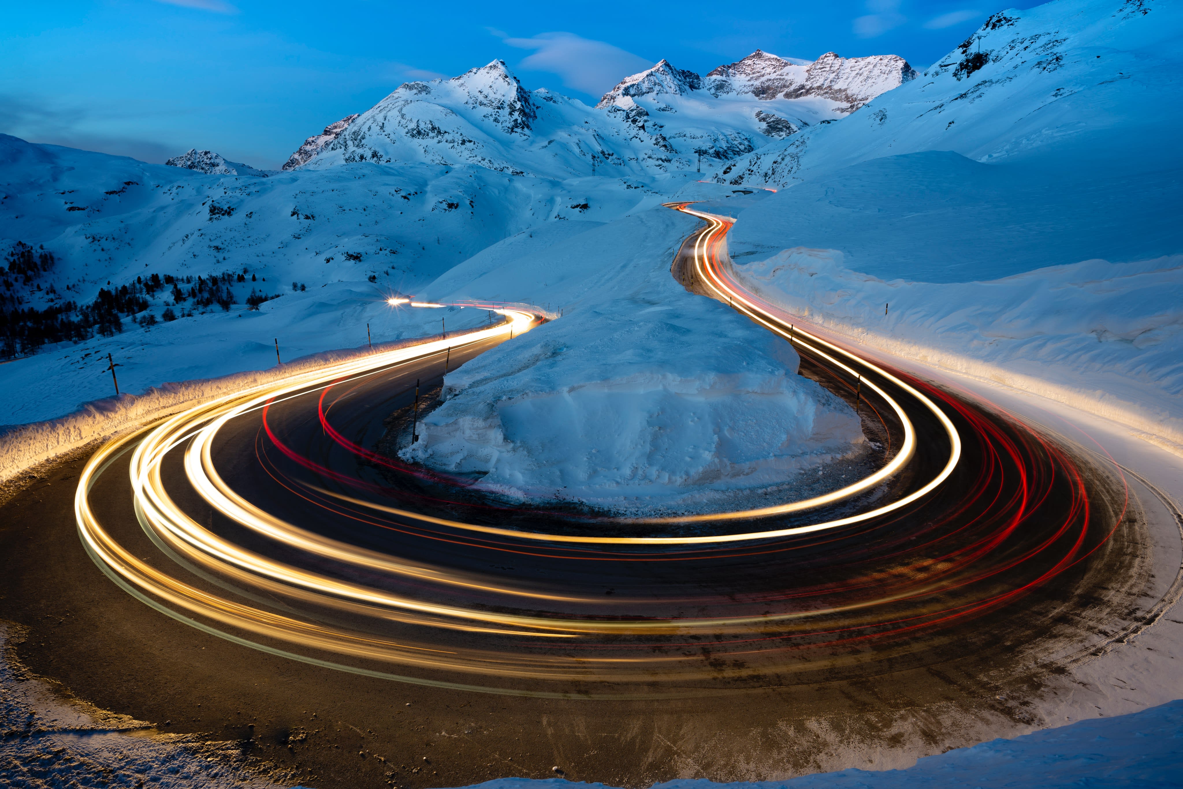 Car lights on a mountain pass