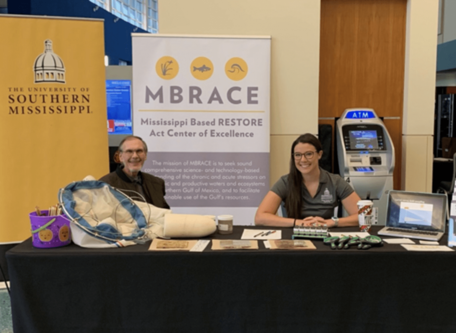 MBRACE researcher Chet Rakocinski (USM) and his graduate student Leah Morgan at the Restoration Summit outreach event.