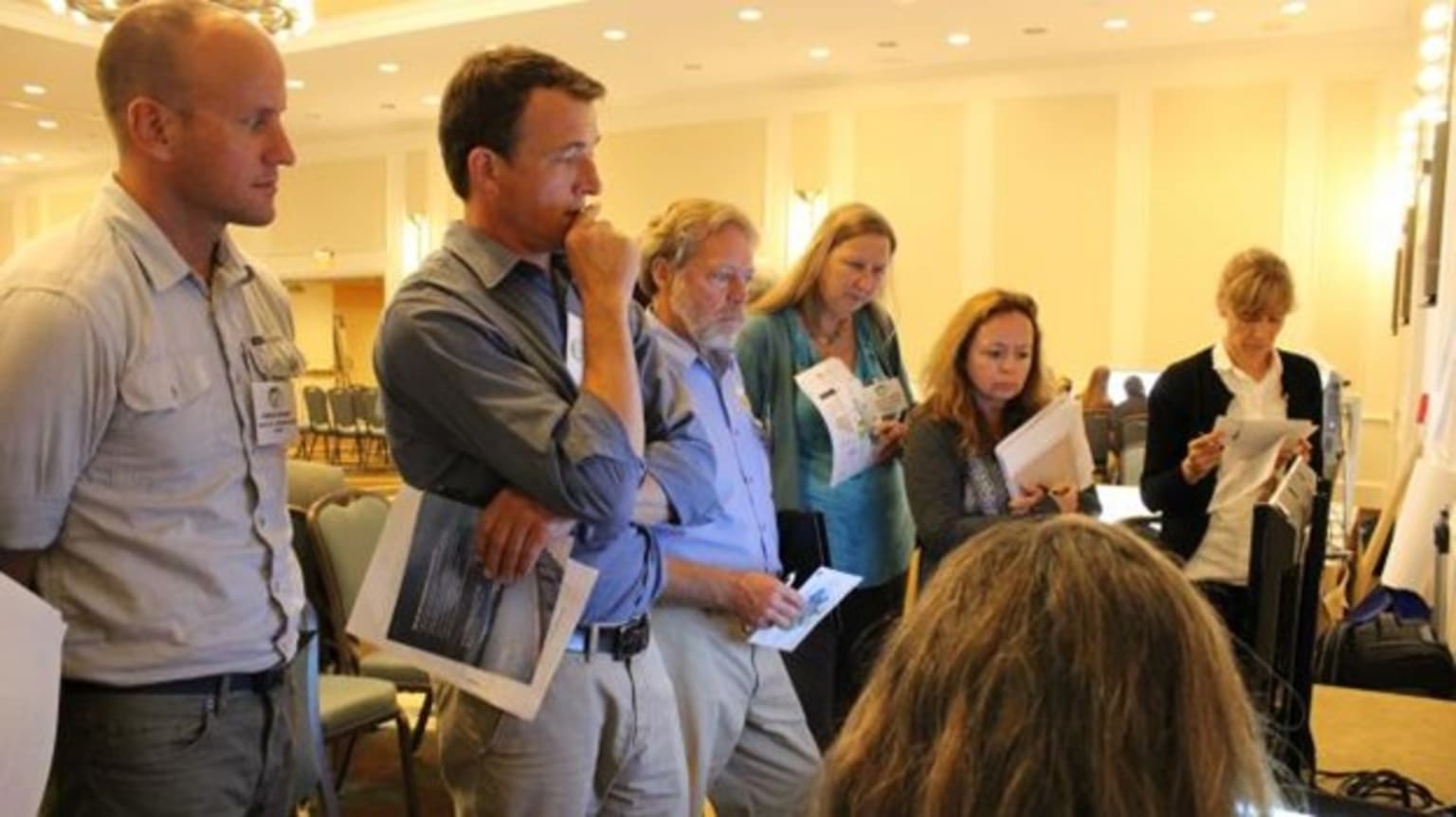 People looking at Tools Cafe presentation.