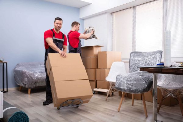 Movers packing a modern residential home