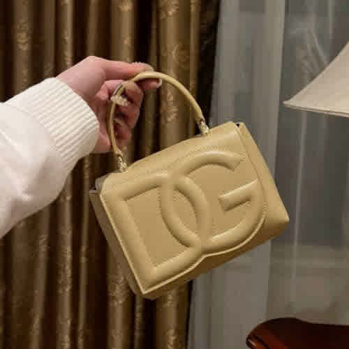 Cream Dolce & Gabbana DG Embossed Top Handle Black Sling Bag
