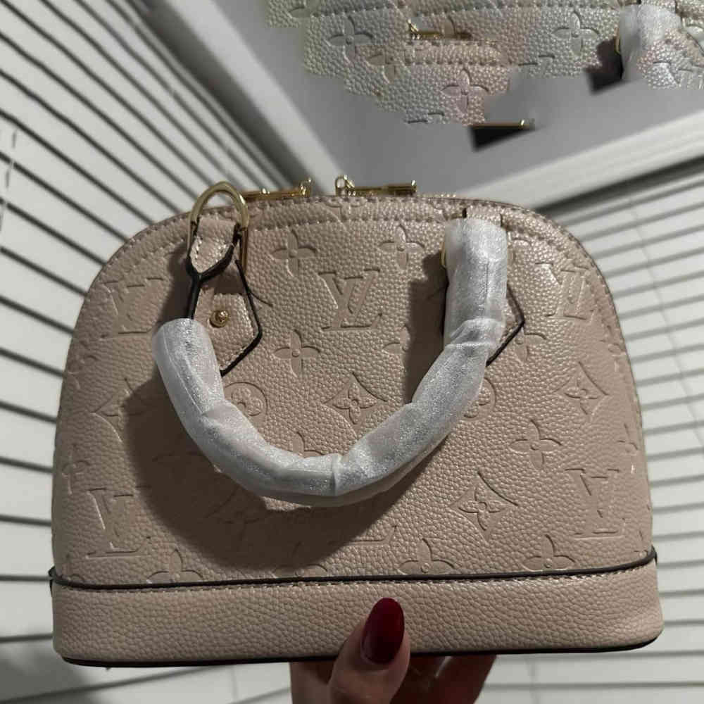 Beige Louis Vuitton Alma Black Handbag