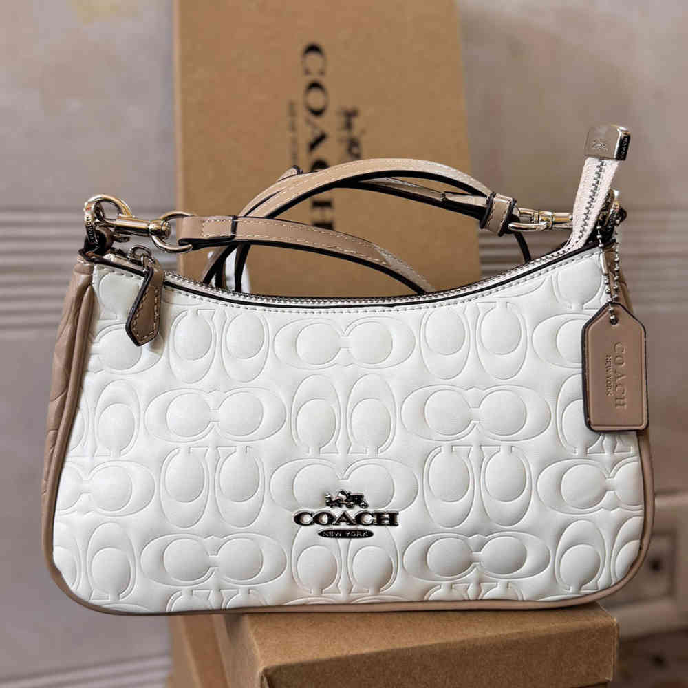 White Coach Terry Embossed Pink Sling Bag