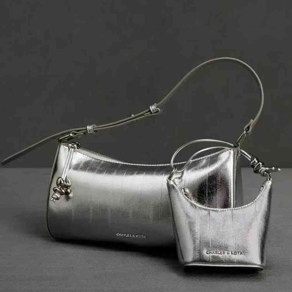 Silver Charles & Keith Augustine Metallic Eel-Effect Black Sling Bag