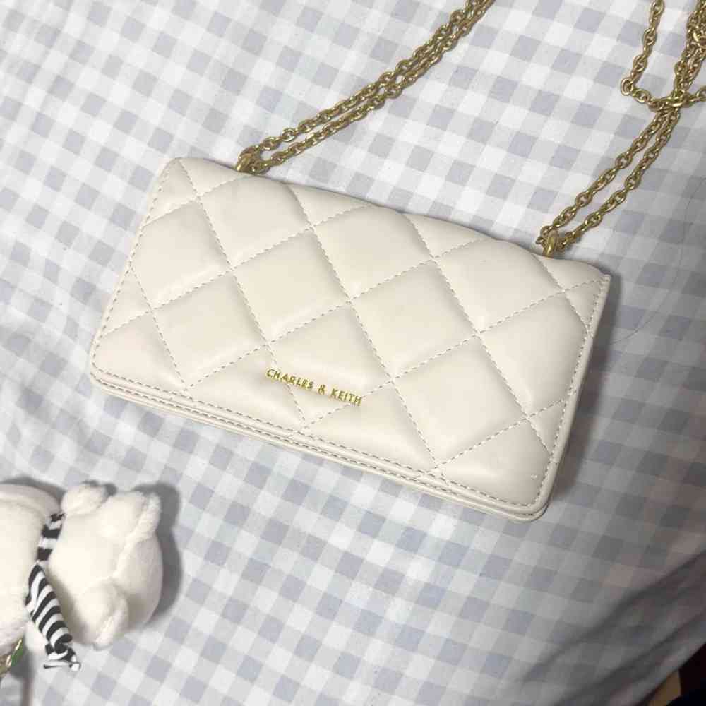 White Charles & Keith Arrietty Quilted Qiki Black Sling Bag