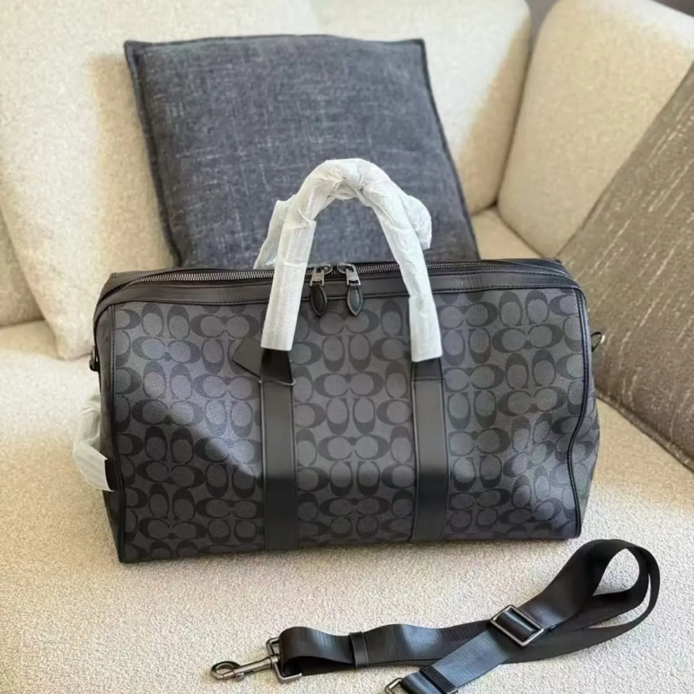 Coach Signature Canvas Venturer Bag