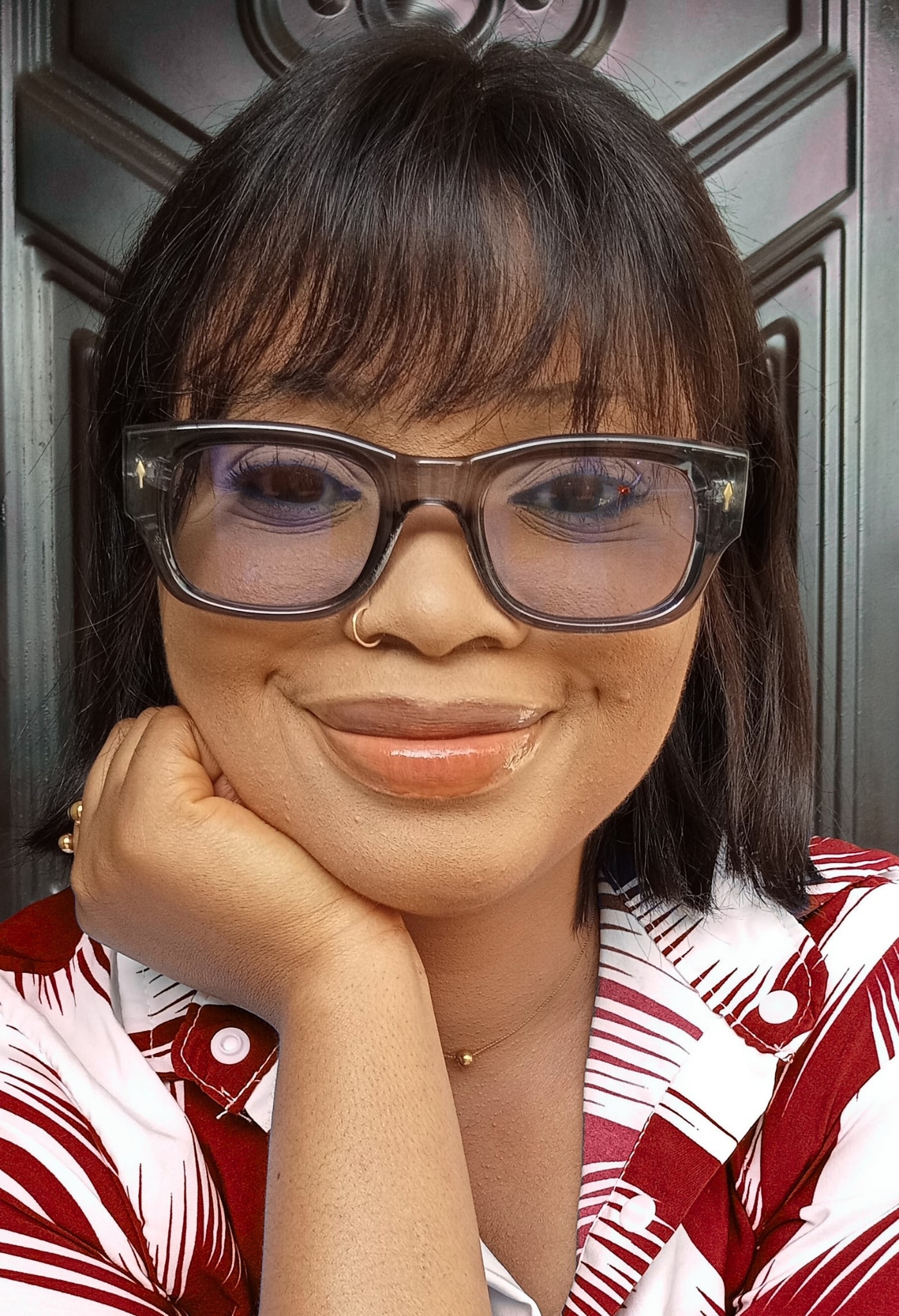 Portrait of Gbemisola Oyeniyi Wearing Glasses