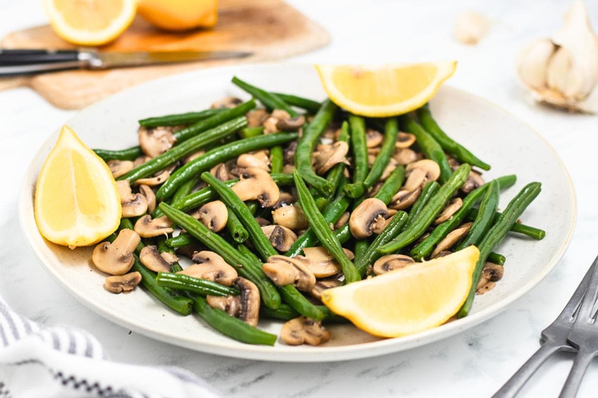 Sautéed green beans with tender mushrooms in a savory glaze.