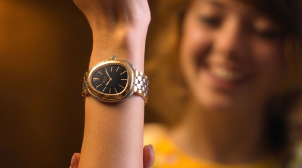 Ash admiring the watch