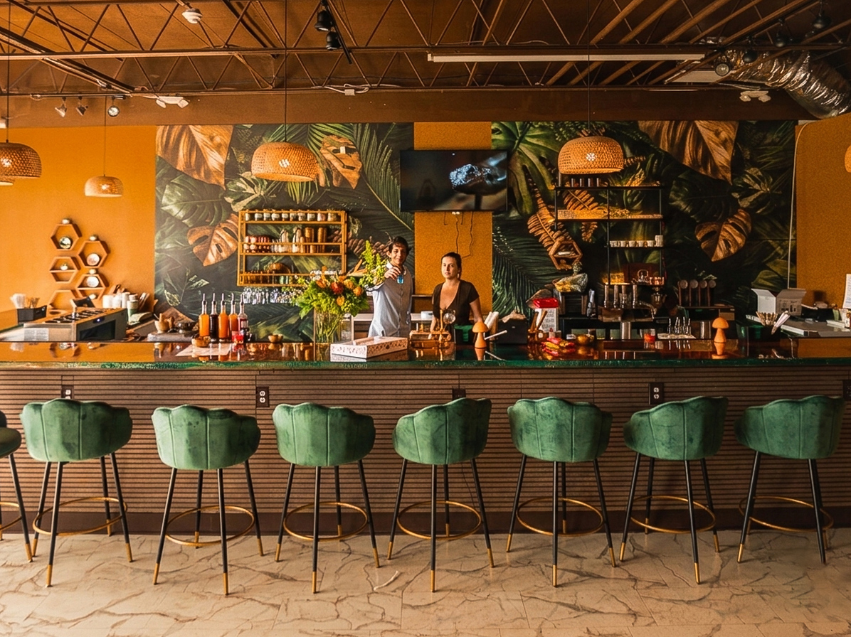 Eternal Roots lounge interior with tropical mural