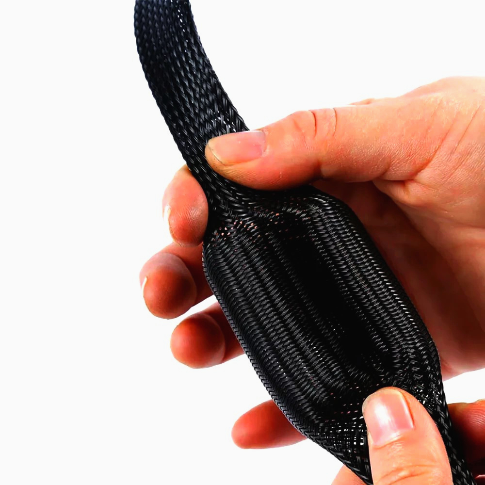 Оплетка JDD PA-012, Ø12 мм, поліамід 6.6, чорна, розтяжка 8-24 мм, 1 м для захисту проводів