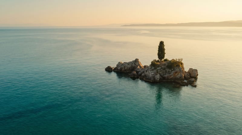 Look development for the island: a rocky islet with a cypress.