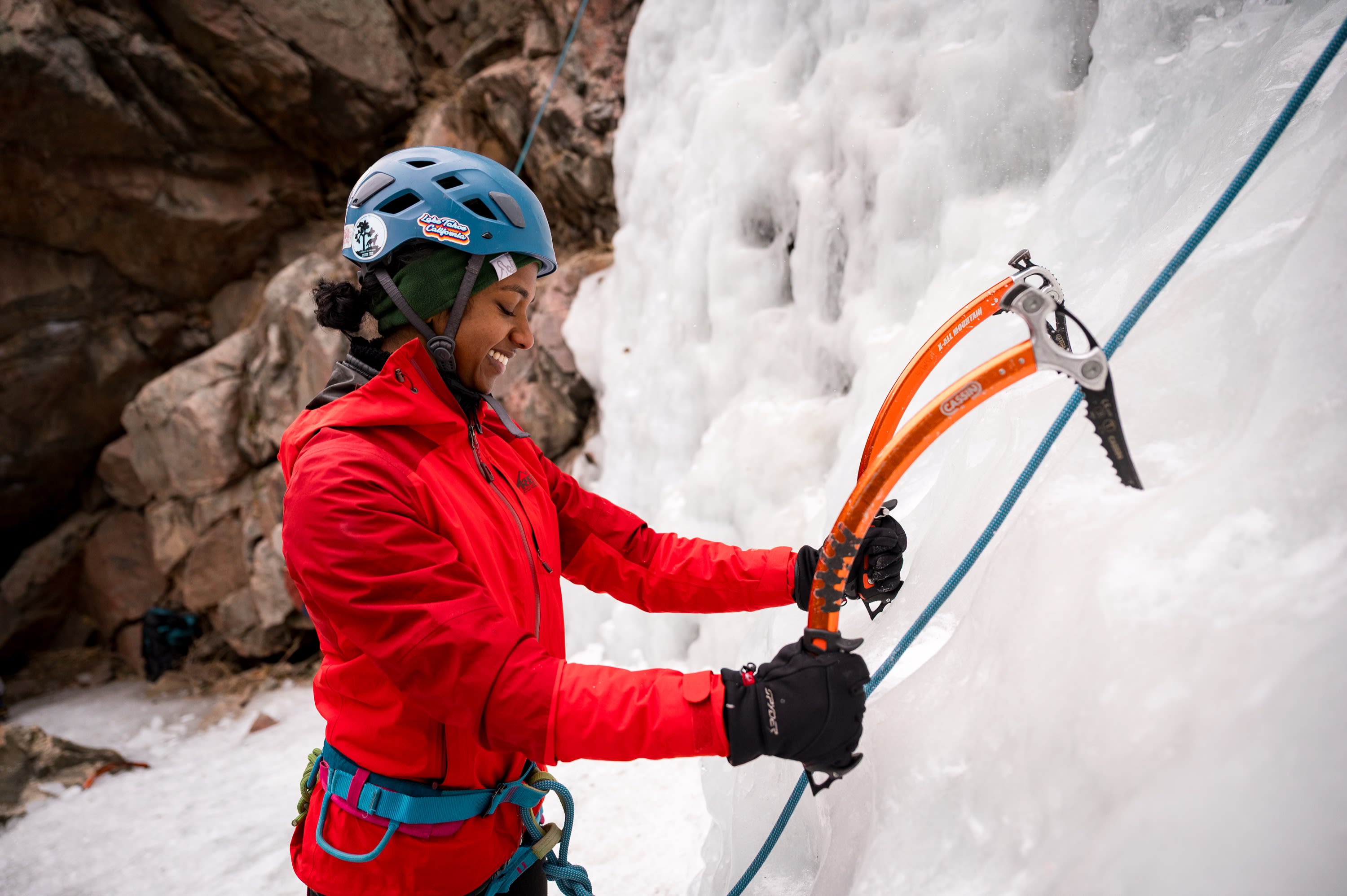 Cruxing in Color ice climbing event — participant action