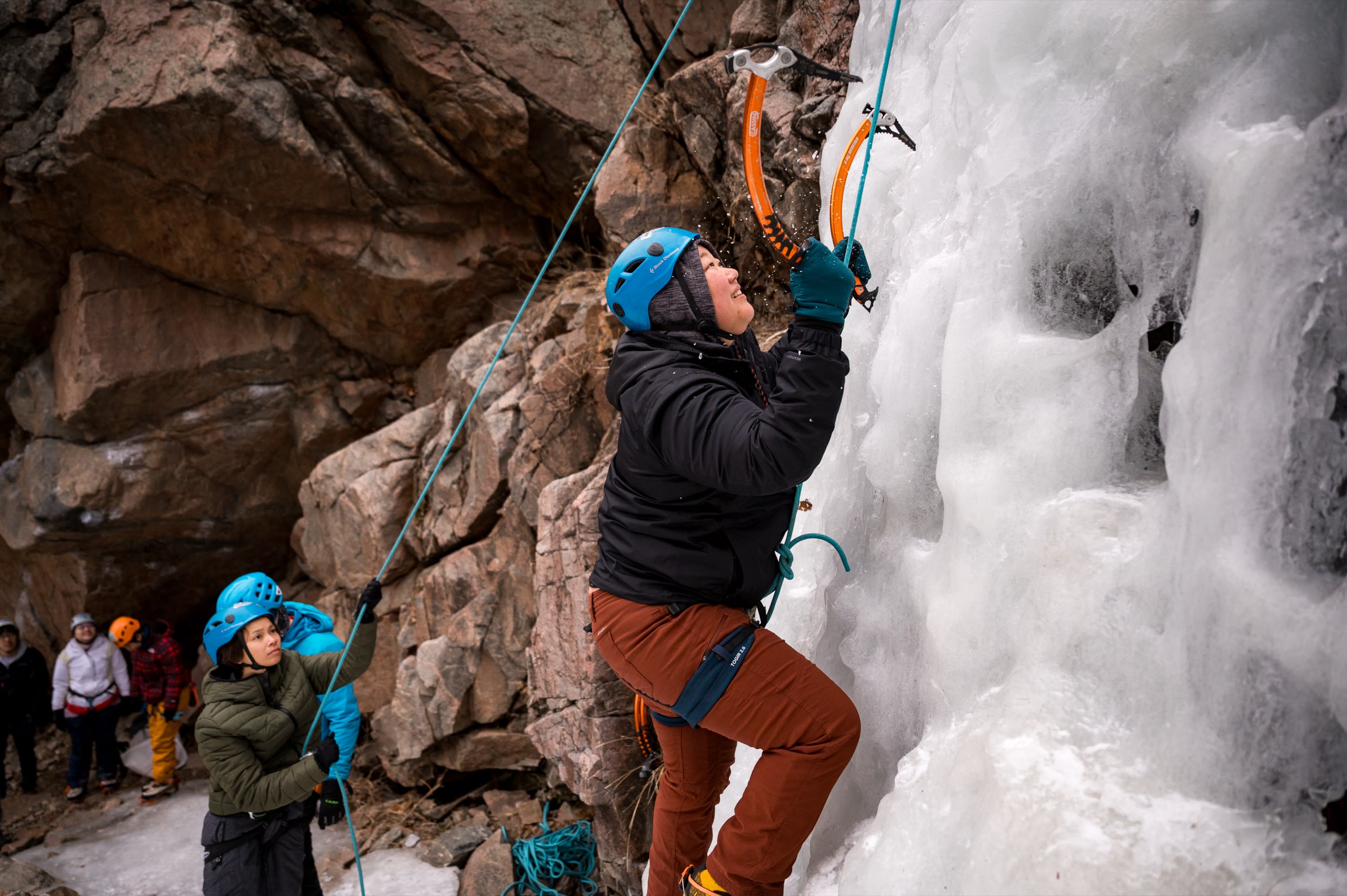 Cruxing in Color ice climbing event — community moment