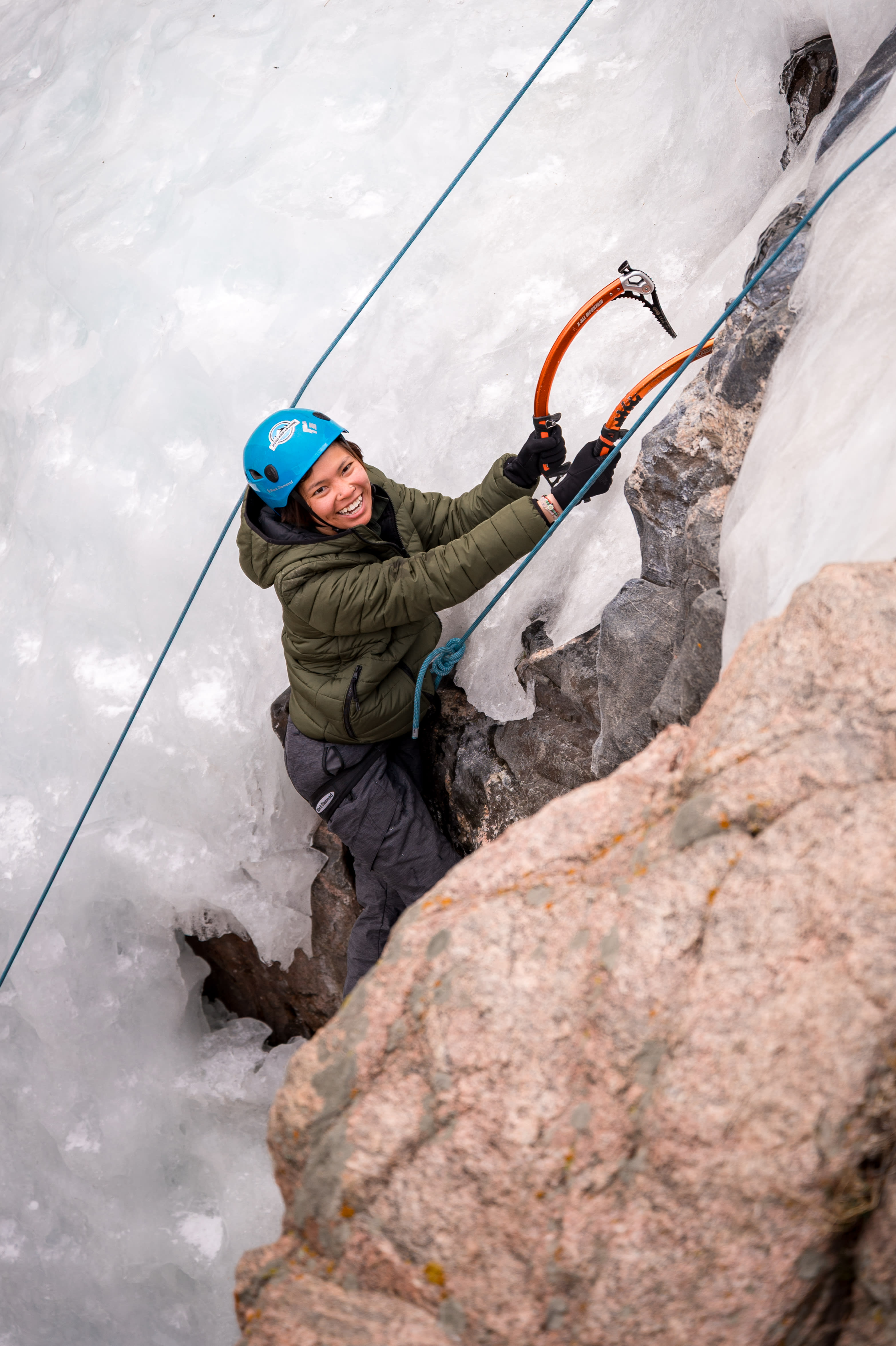 Cruxing in Color ice climbing event — climber portrait