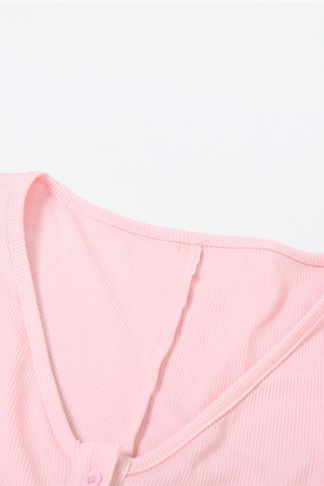 Sexy V-neck Buttoned Long-sleeved Slim Hip-covering Solid Color Jumpsuit