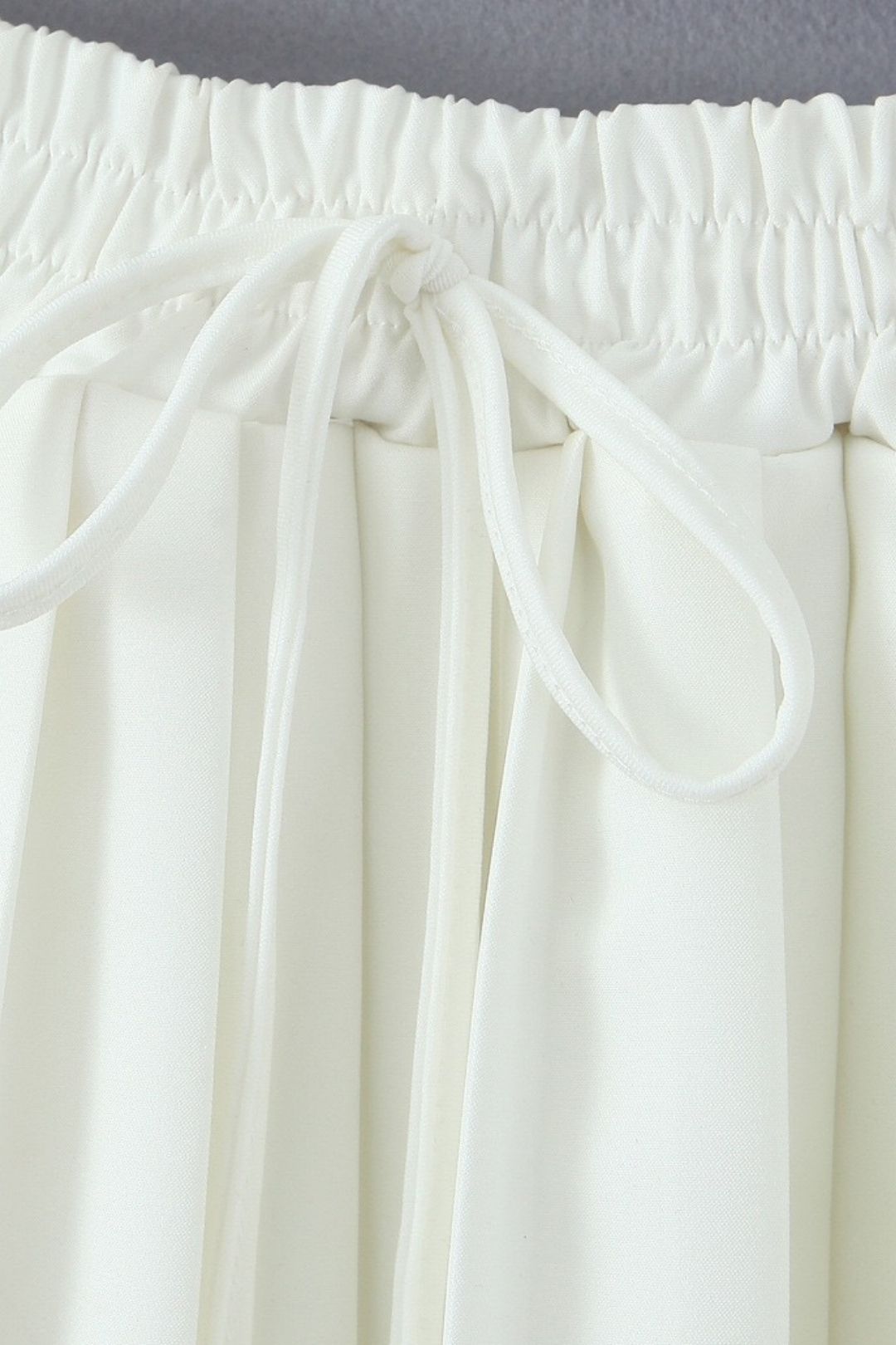 V-neck Sleeveless Button Suit Vest + Pleated Lace-up Skirt