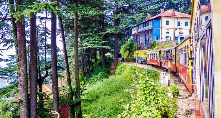 Toy train in mountain valley