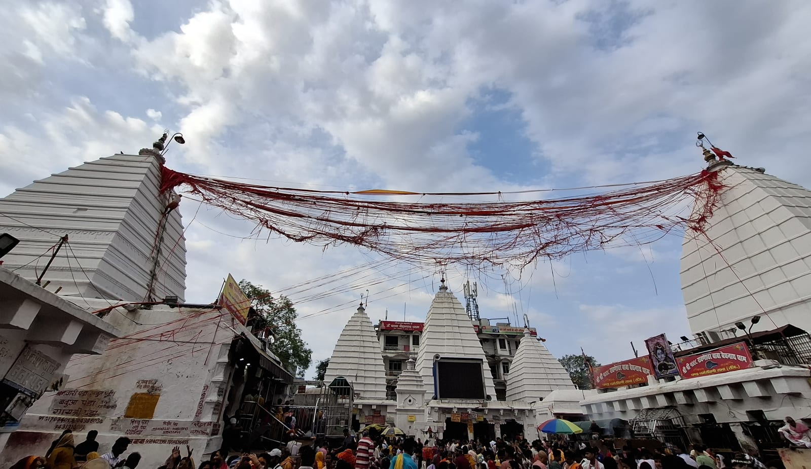 White temple towers and red sacred threads over the Baidyanath Dham complex in Deoghar, March 2026