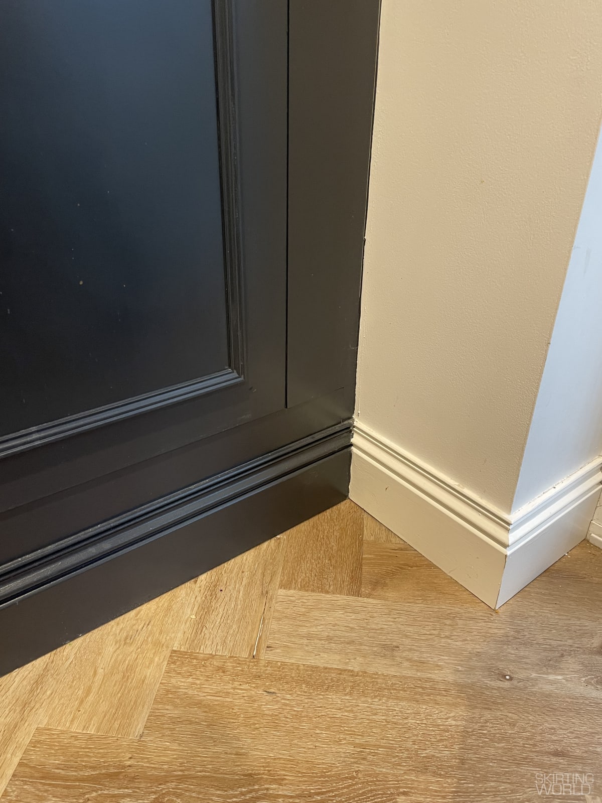 Black Elegance MDF skirting board paired with a black feature wall in a living room