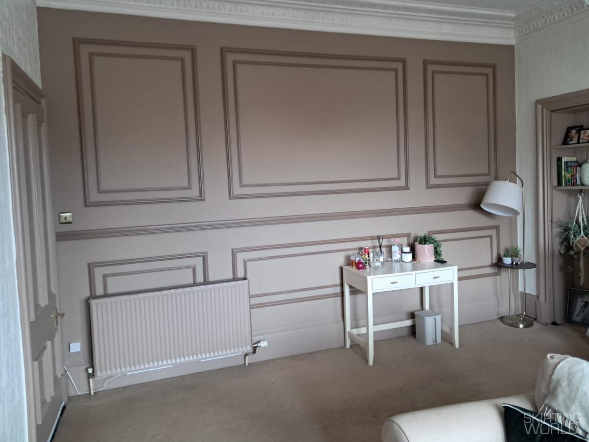 Warm taupe full-wall panelling with Ogee 2 MDF picture rail in a bedroom