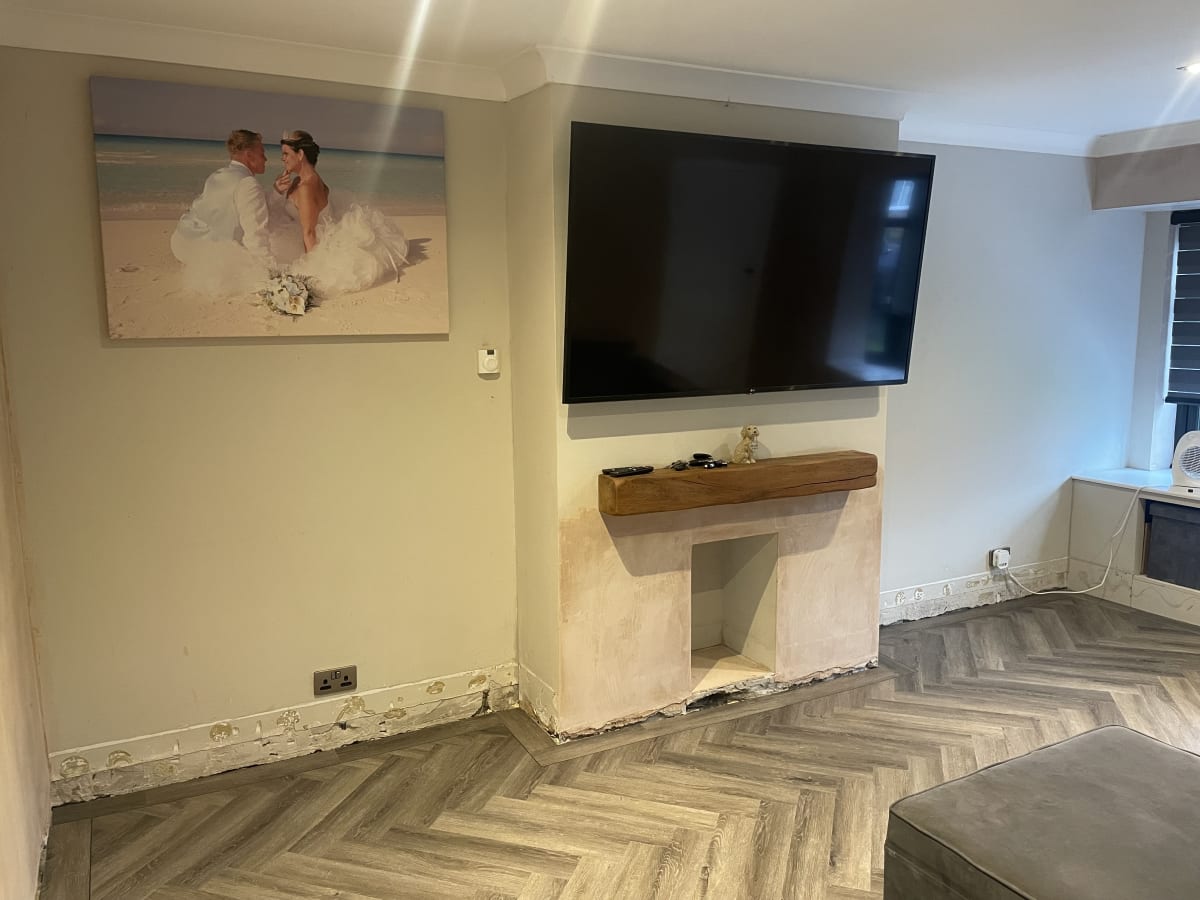 Living room before slat panelling installed in the alcoves