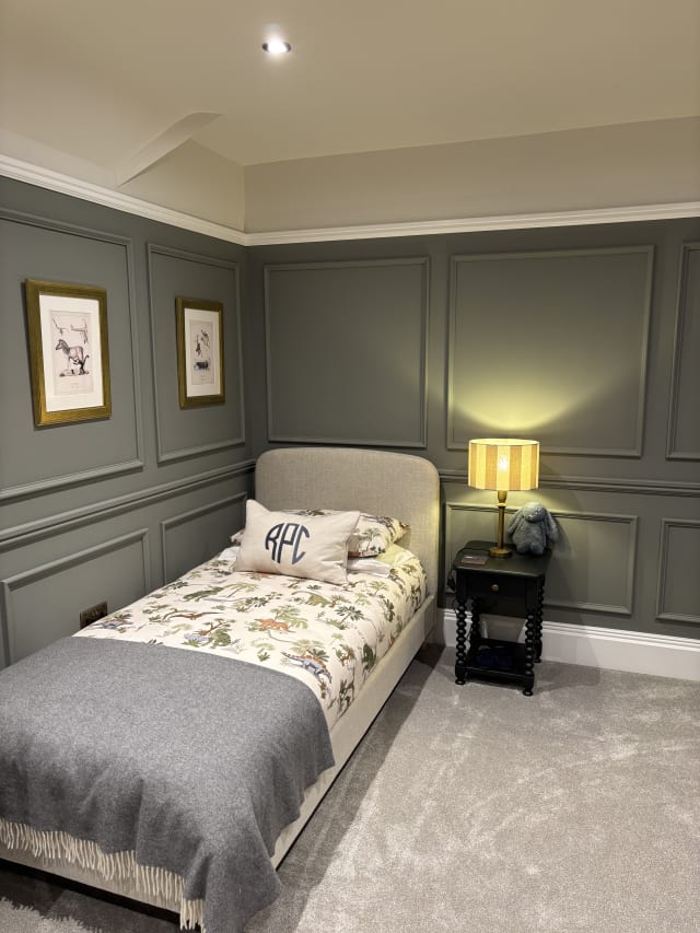 Grey-green bedroom wall panelling in 324 MDF panel moulding, with upper and lower panels split by a rail