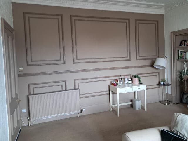 Double-frame wall panelling in Astragal and Astragal Maxi panel moulding with a 330 dado rail, on a pink feature wall
