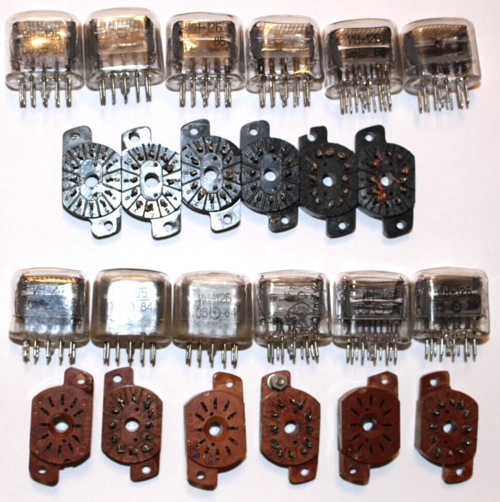 Twelve used IN-12 tubes with black and brown sockets