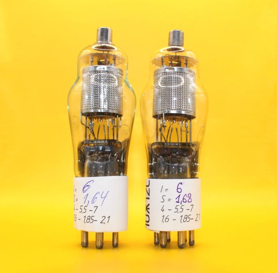 Two Svetlana 10J12S pentodes showing their top caps, internal shields and base pins