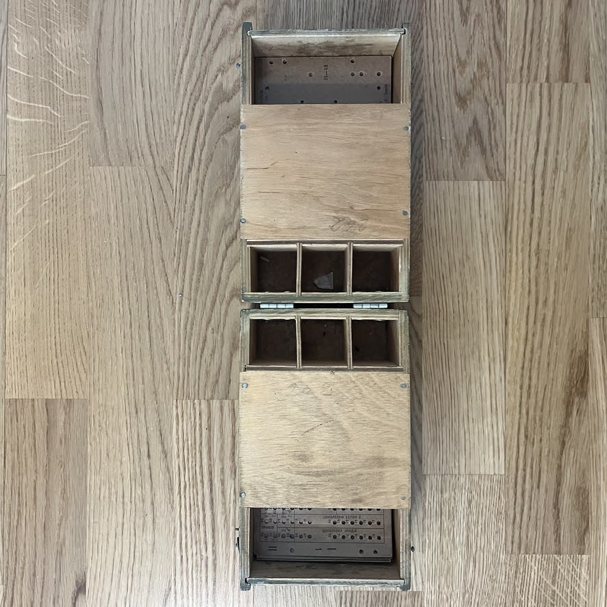 The L3-3 card set stored in its wooden case, opened up