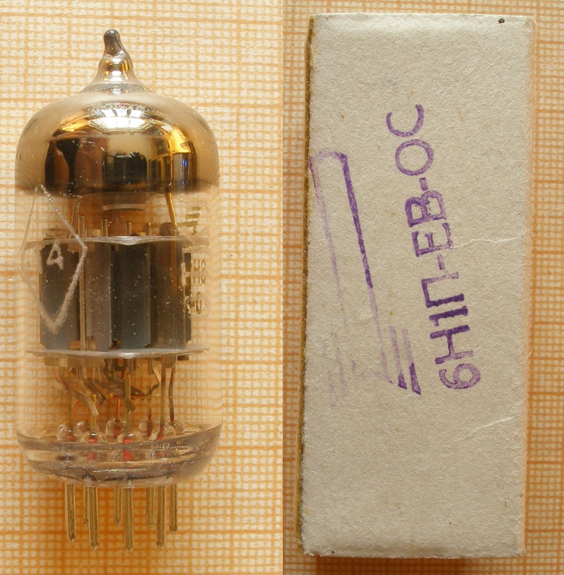 Soviet 6N1P-EV-OS tube with etched diamond mark next to its box with purple Voskhod factory stamps
