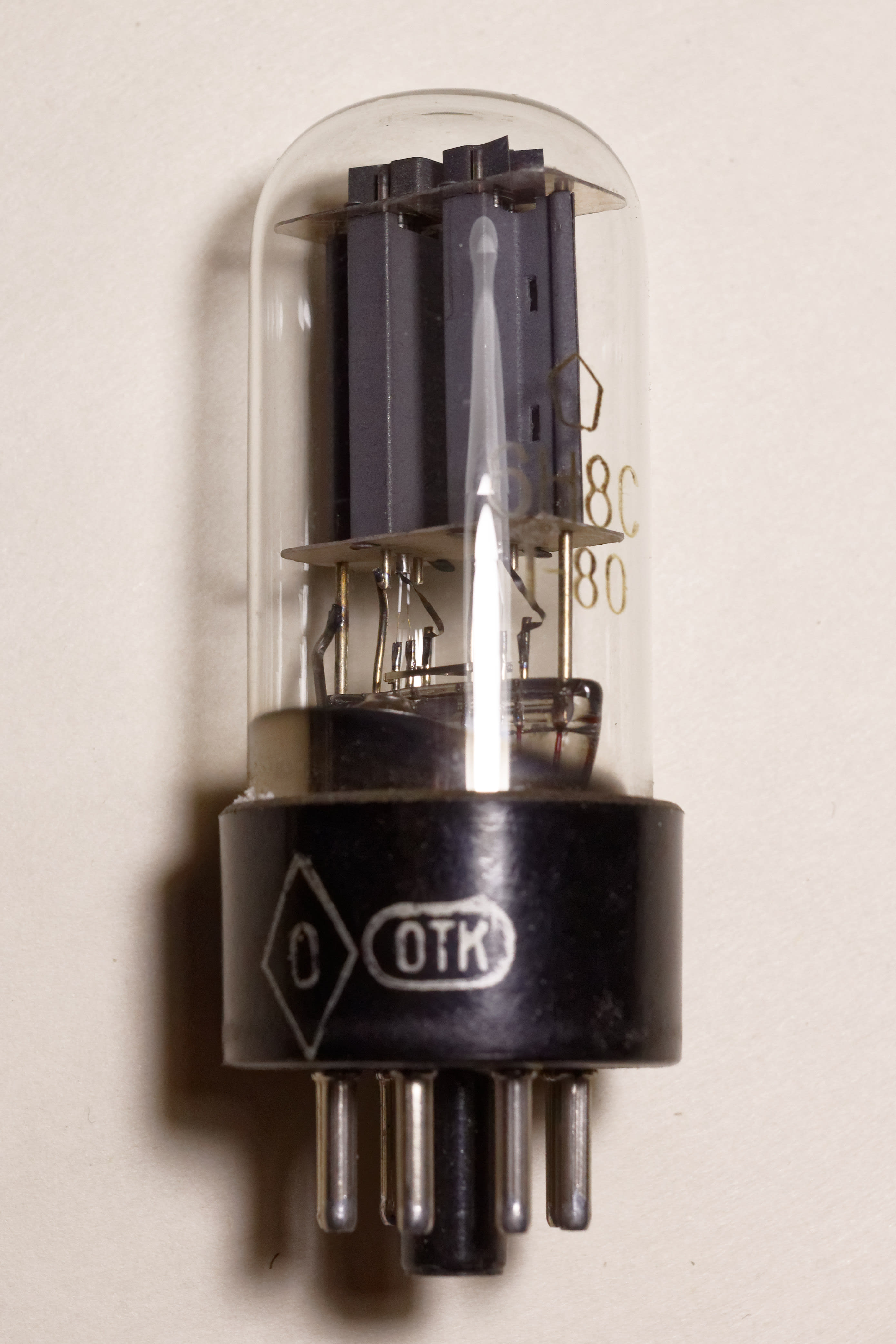 Soviet 6N8S tube with OTK oval stamp and military rhombus stamp on the base, type designation, date code and NEVZ factory logo on the glass