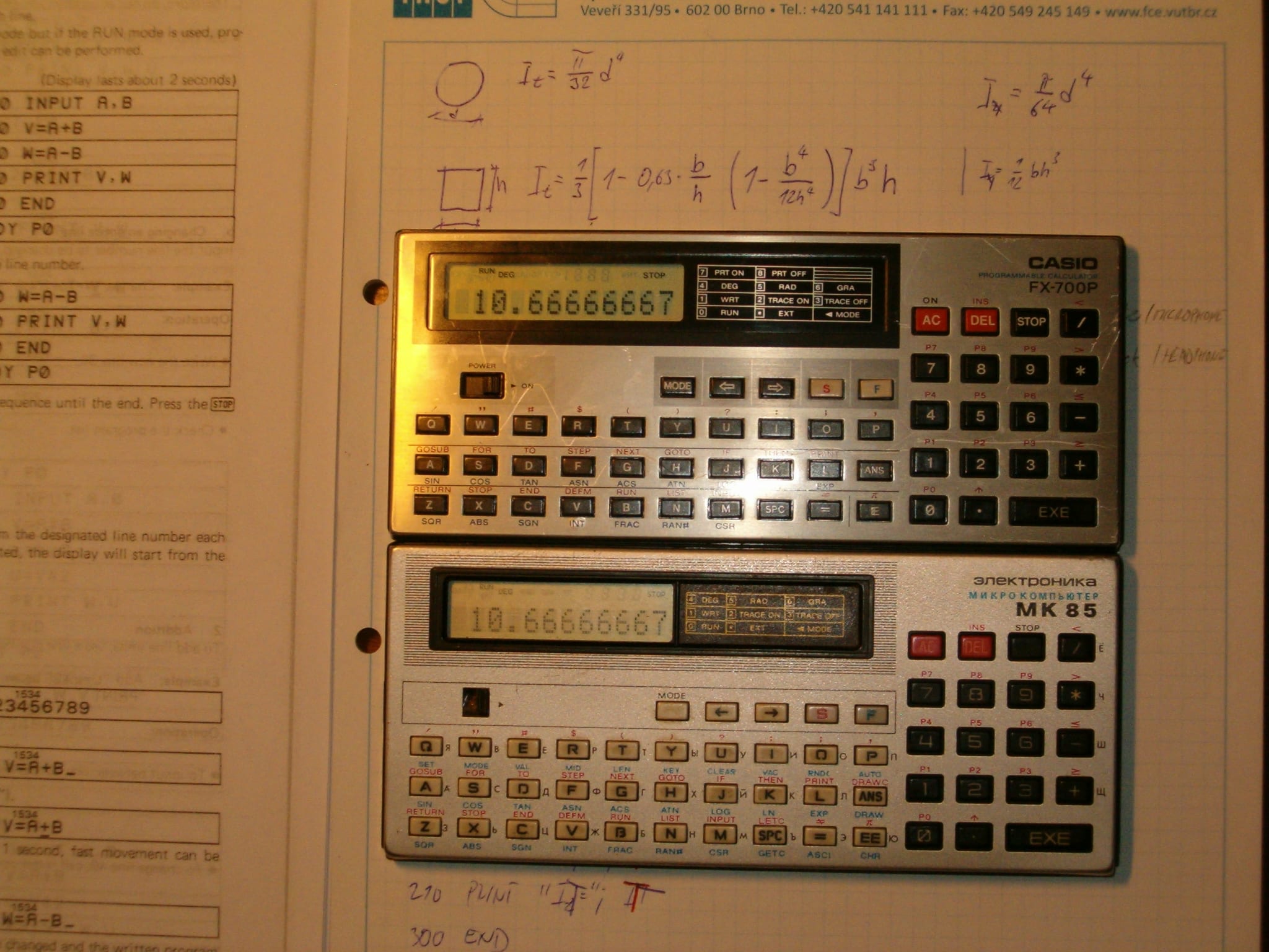 Casio FX-700P and Elektronika MK-85 pocket computers side by side on an engineering notebook, both displaying the same calculation result
