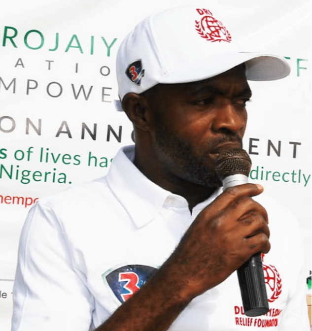 Akanni Kazeem Durojaiyeola in a DRF cap speaking into a microphone