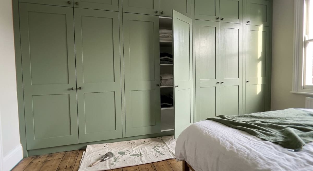 Sage green fitted wardrobes painted in eggshell