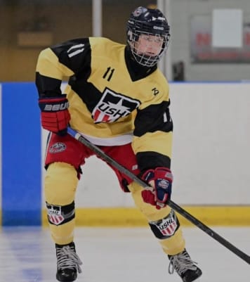 Sawyer playing hockey