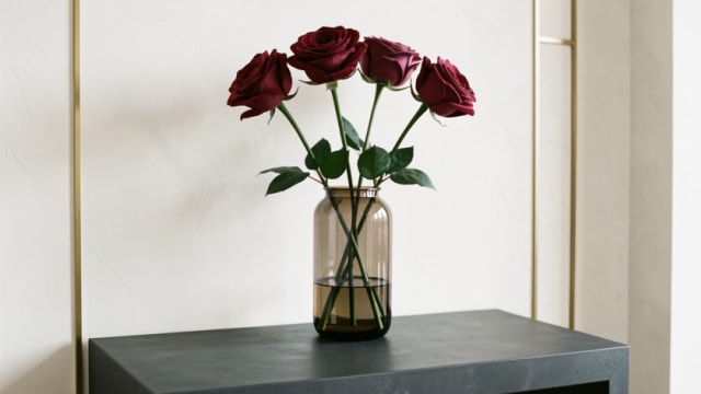 Real-touch red artificial roses arranged in a vase for home decor