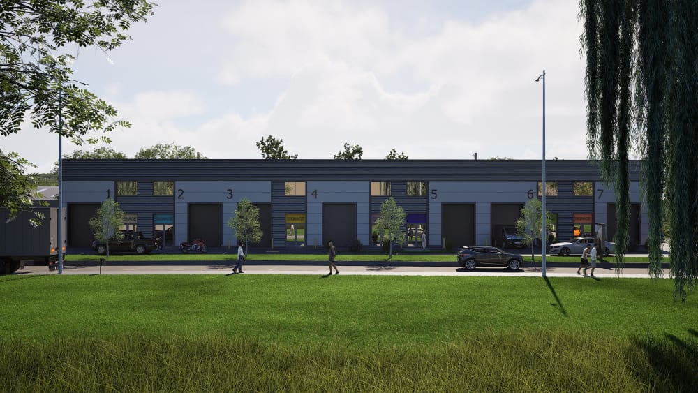 Modern industrial warehouse complex with 7 numbered units featuring dark blue cladding, roller doors, and landscaped frontage