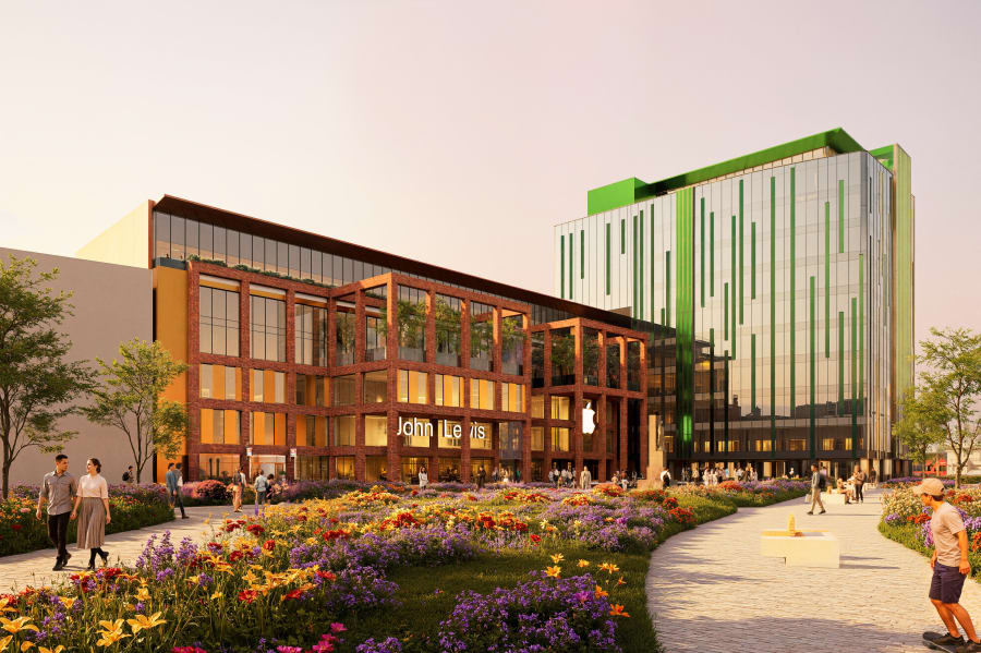Modern mixed-use development featuring John Lewis store with brick facade, Apple retail space, and green-accented office tower