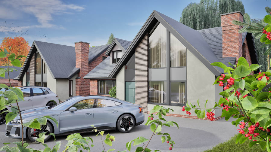 Modern residential development featuring A-frame homes with brick chimneys, timber cladding, and large glazed gables