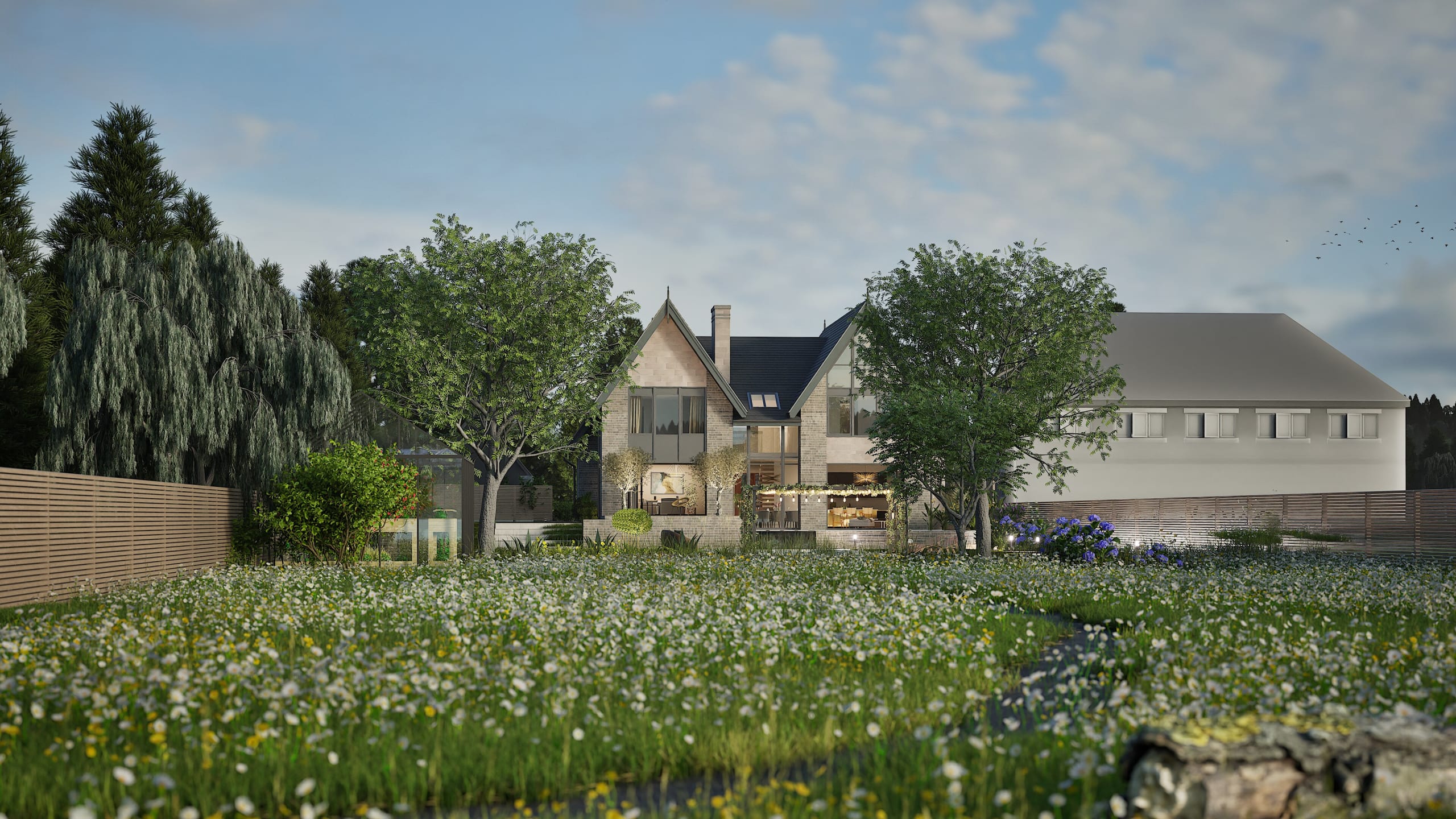 Modern farmhouse-style home with stone and glass facade, featuring gabled roofs, covered patio, and wildflower meadow garden