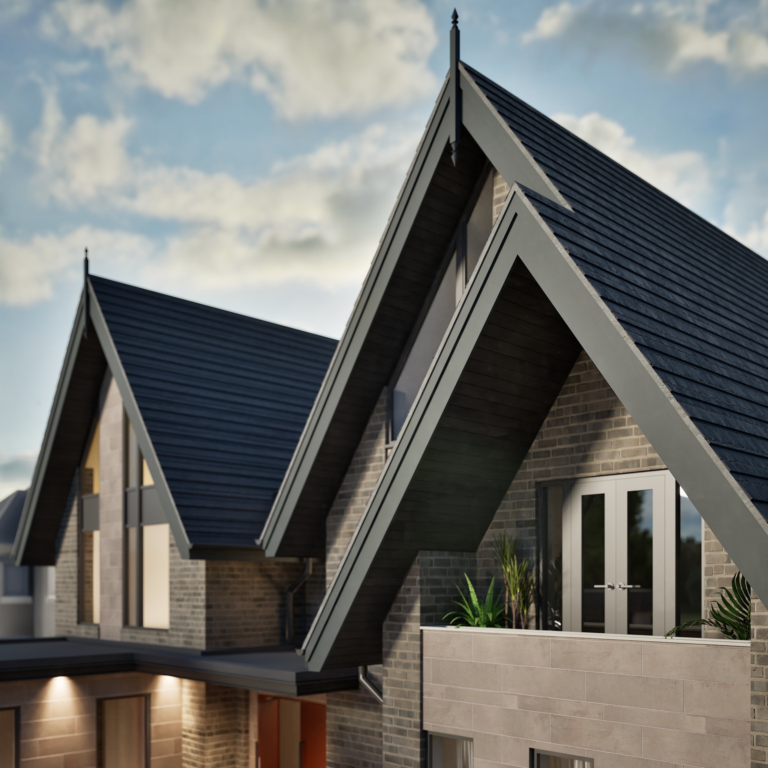 Modern residential homes featuring steep A-frame gables with dark slate roofs, brick facades, and upper balcony