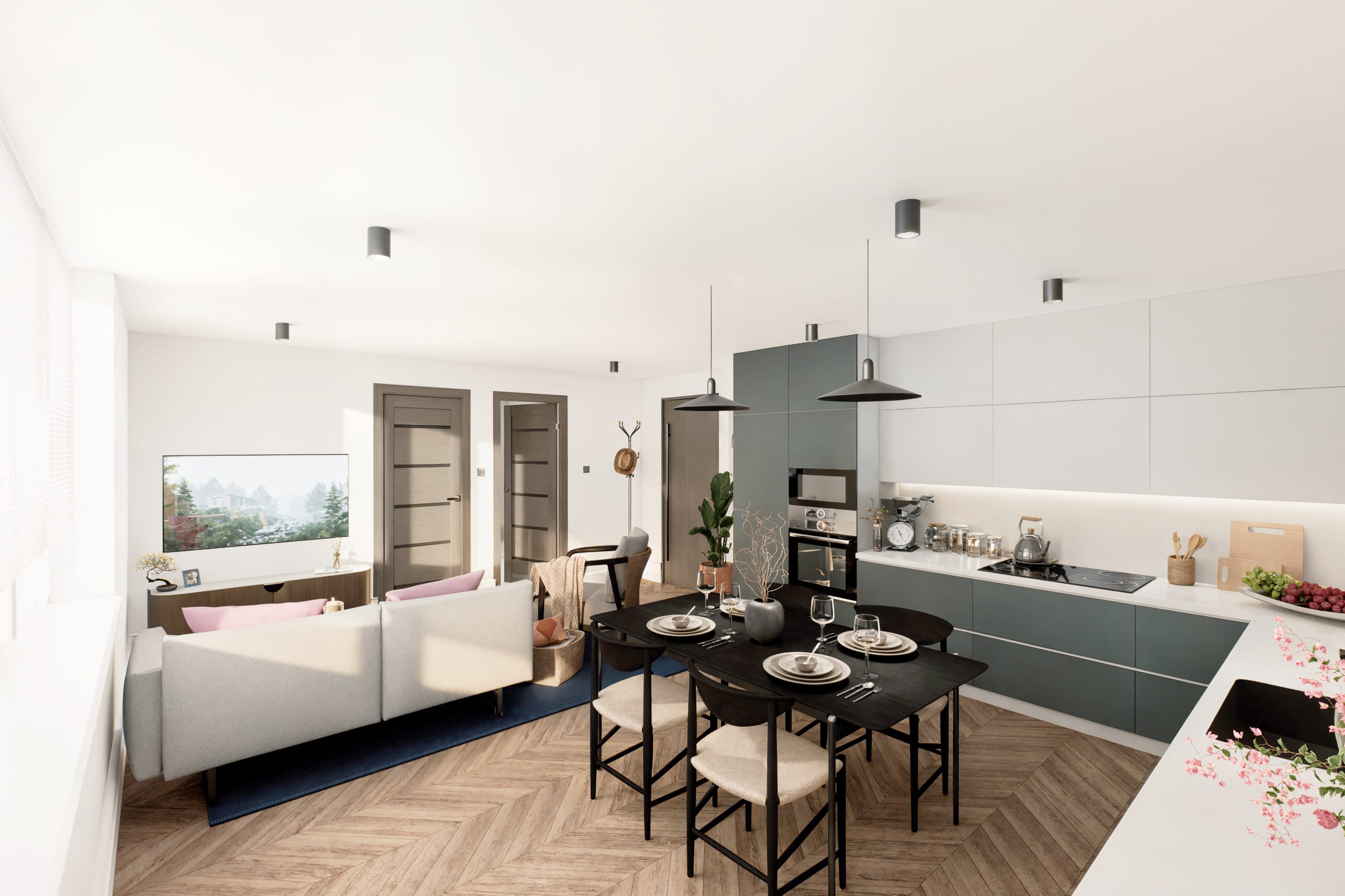 Modern open-plan living space with kitchen, dining area, cream sofa, herringbone wood flooring, and teal cabinetry