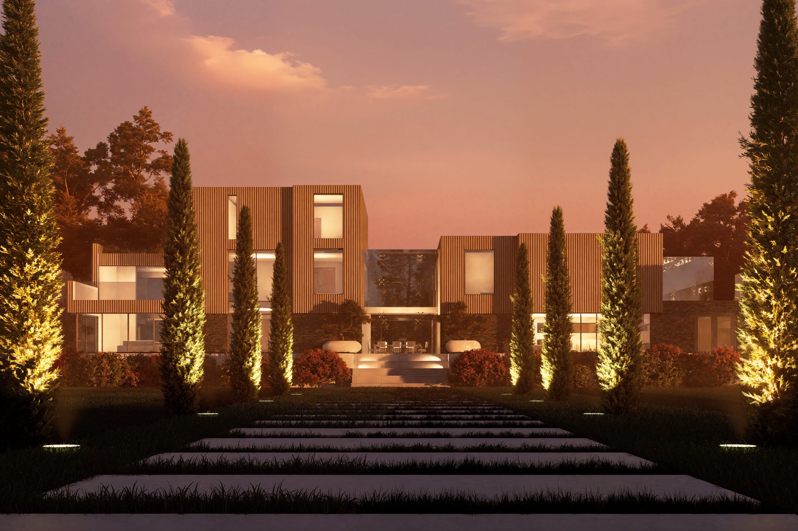Modern luxury residence at dusk featuring vertical wood slat cladding, large windows, and illuminated cypress tree landscaping