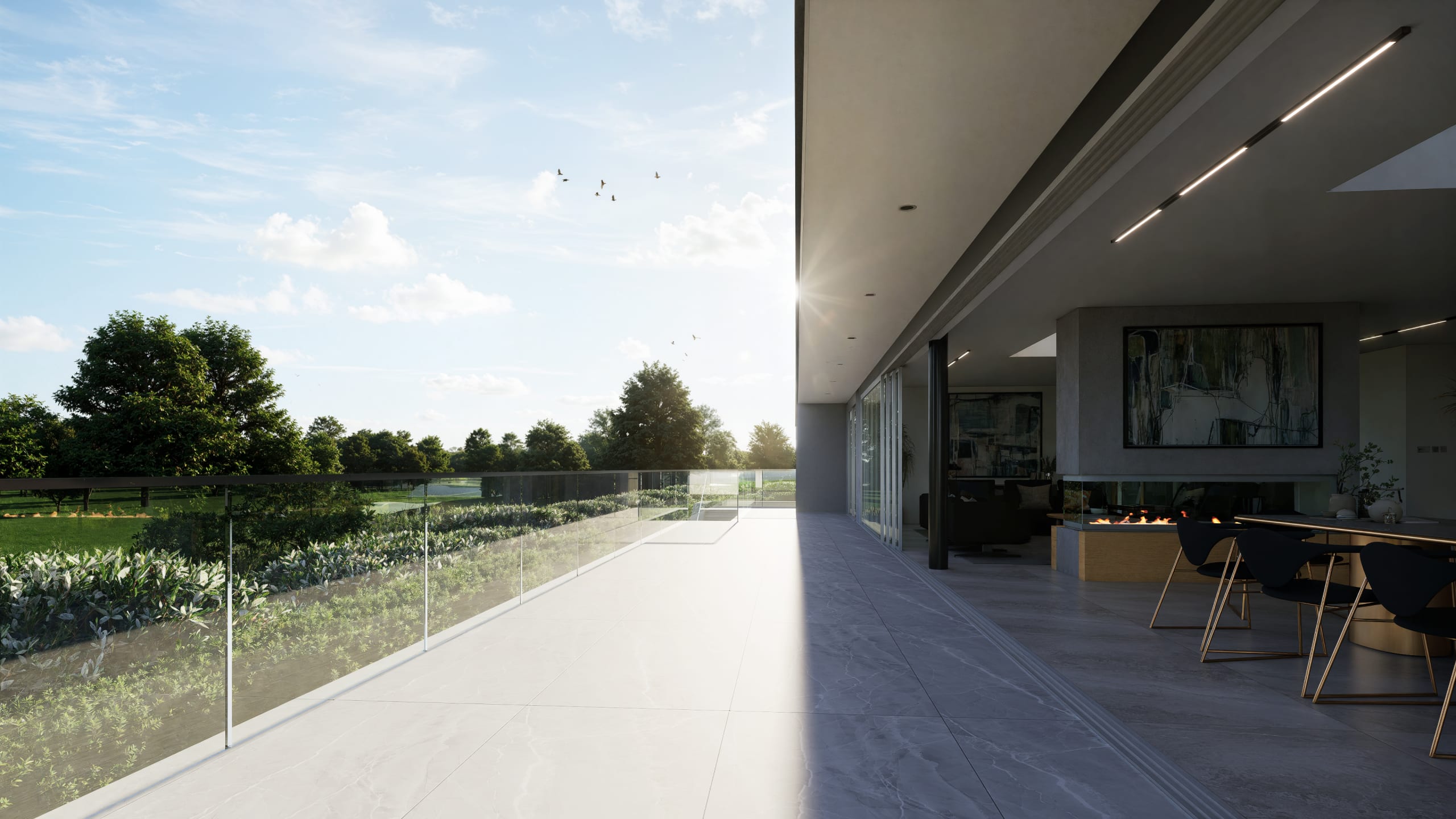 Modern balcony with glass railing overlooking green landscape, seamless indoor-outdoor living space with dining area and fireplace