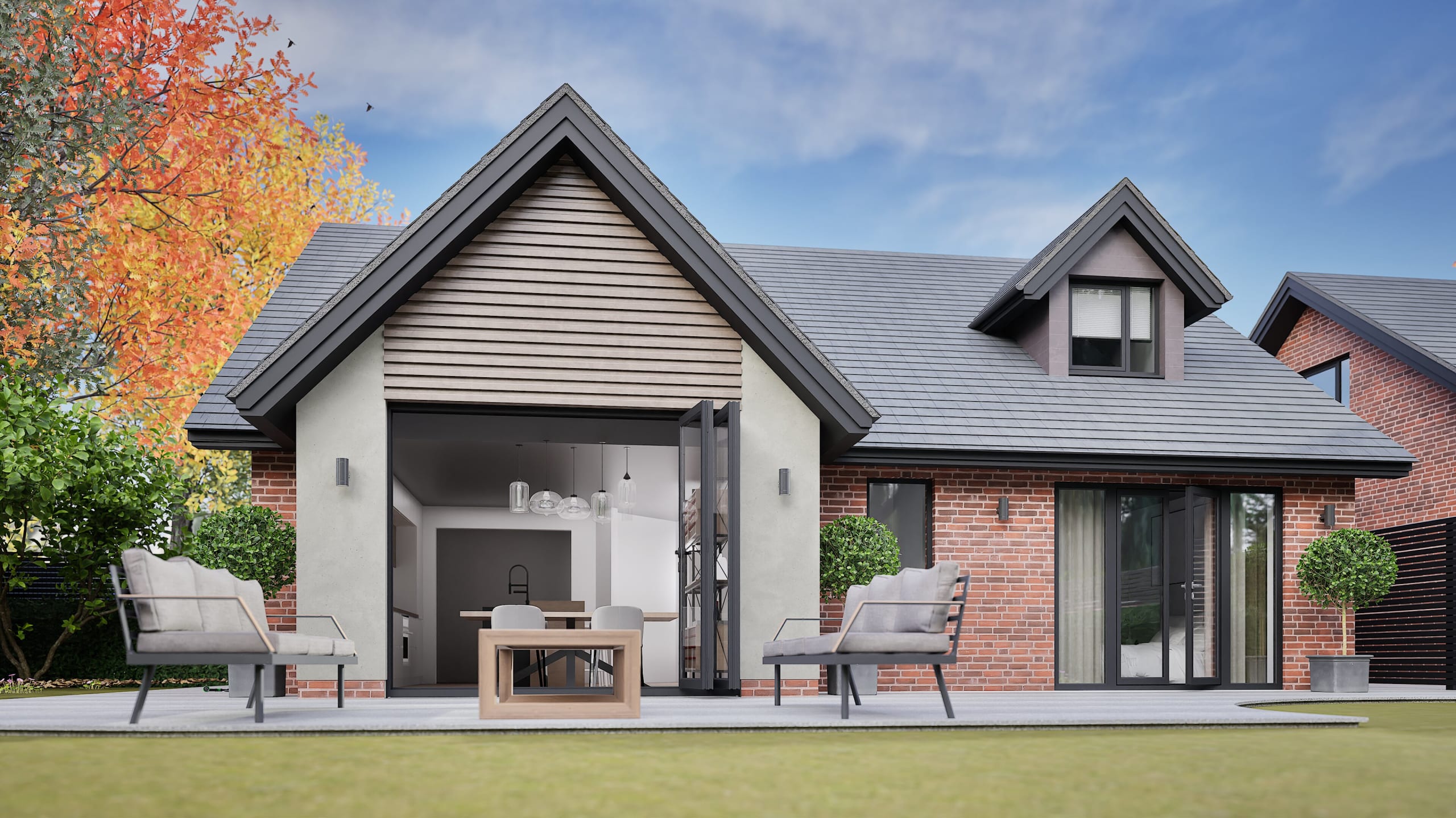 Modern home exterior with brick and render finish, bifold doors opening to kitchen, outdoor seating on patio with lawn