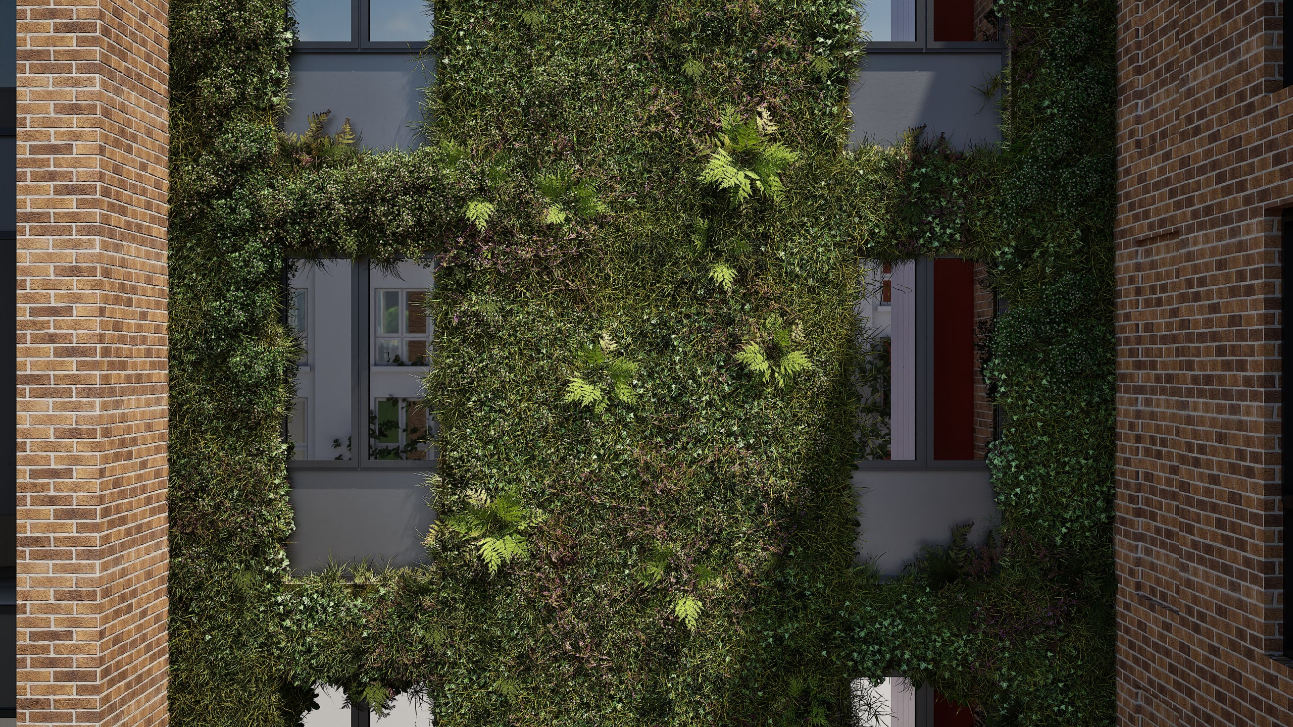 Modern building facade featuring extensive living green wall with lush vegetation framed by brown brick columns and windows