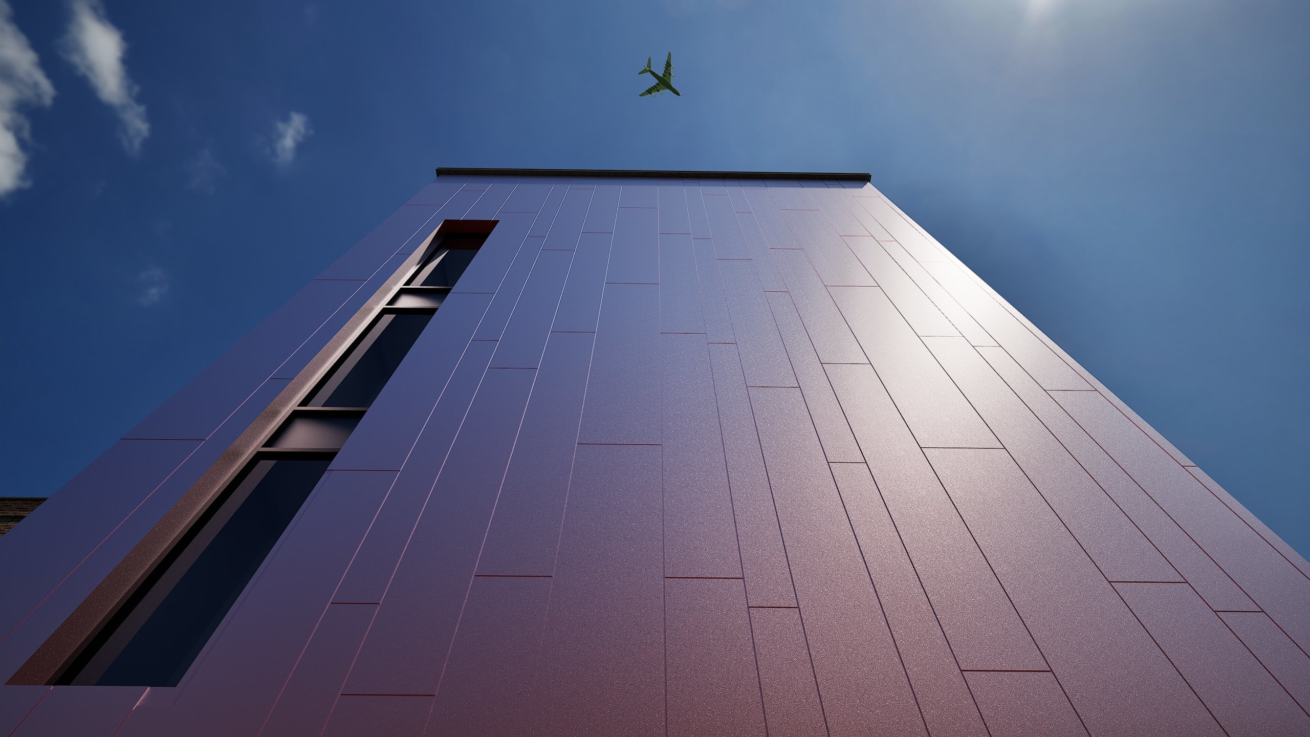 Upward view of modern building with purple metallic panel facade and narrow vertical window, airplane crossing blue sky